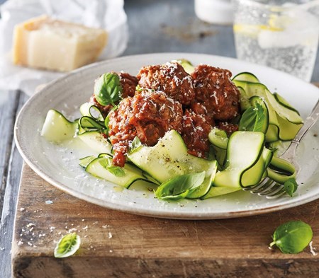Meatballs served with courgette ribbons